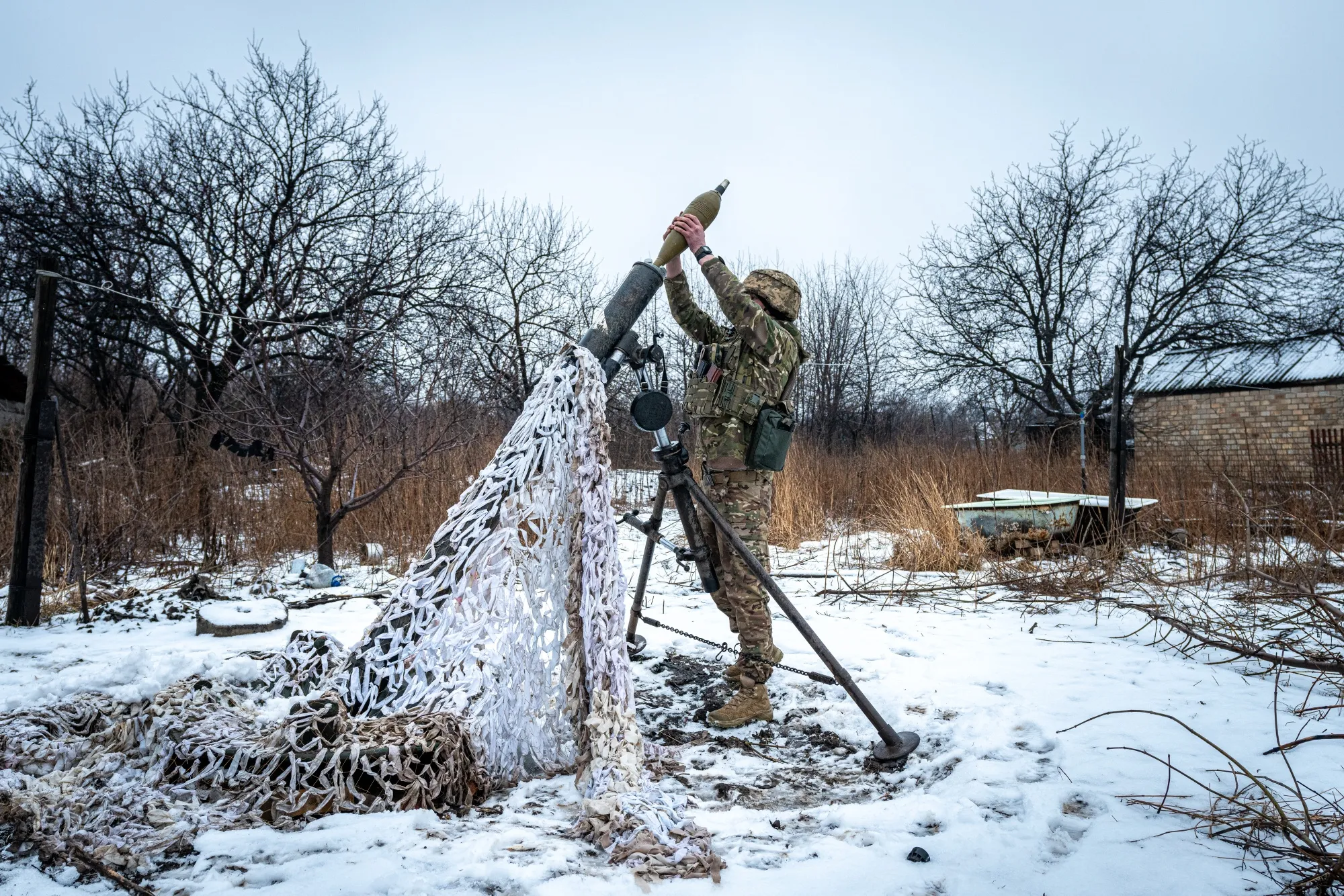 A Ukrainian soldier loads a mortar shell&nbsp;in the direction of Bakhmut, Ukraine.