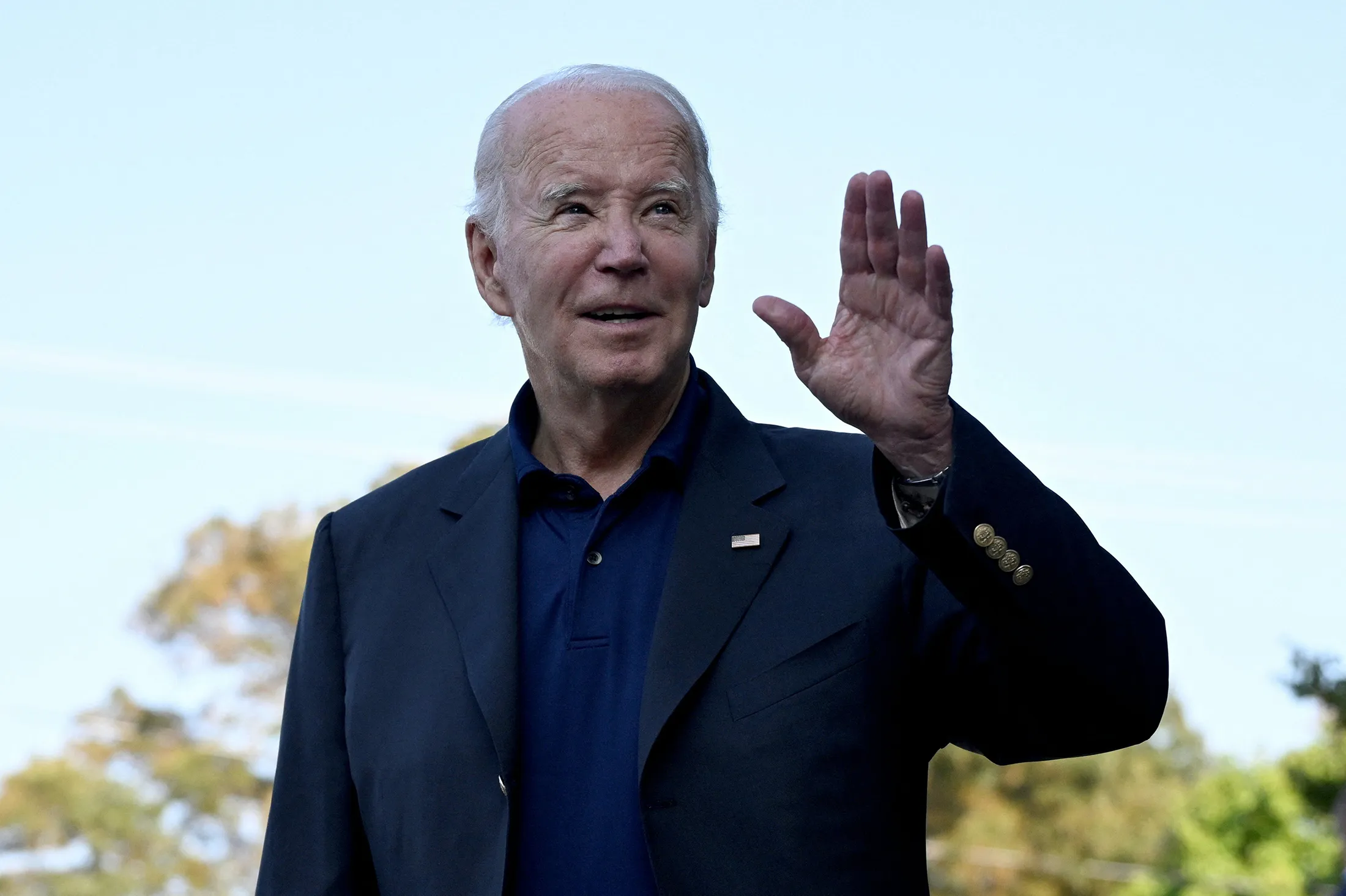 President Joe Biden speaks to members of the media&nbsp;in Rehoboth Beach, Delaware, on Sunday.