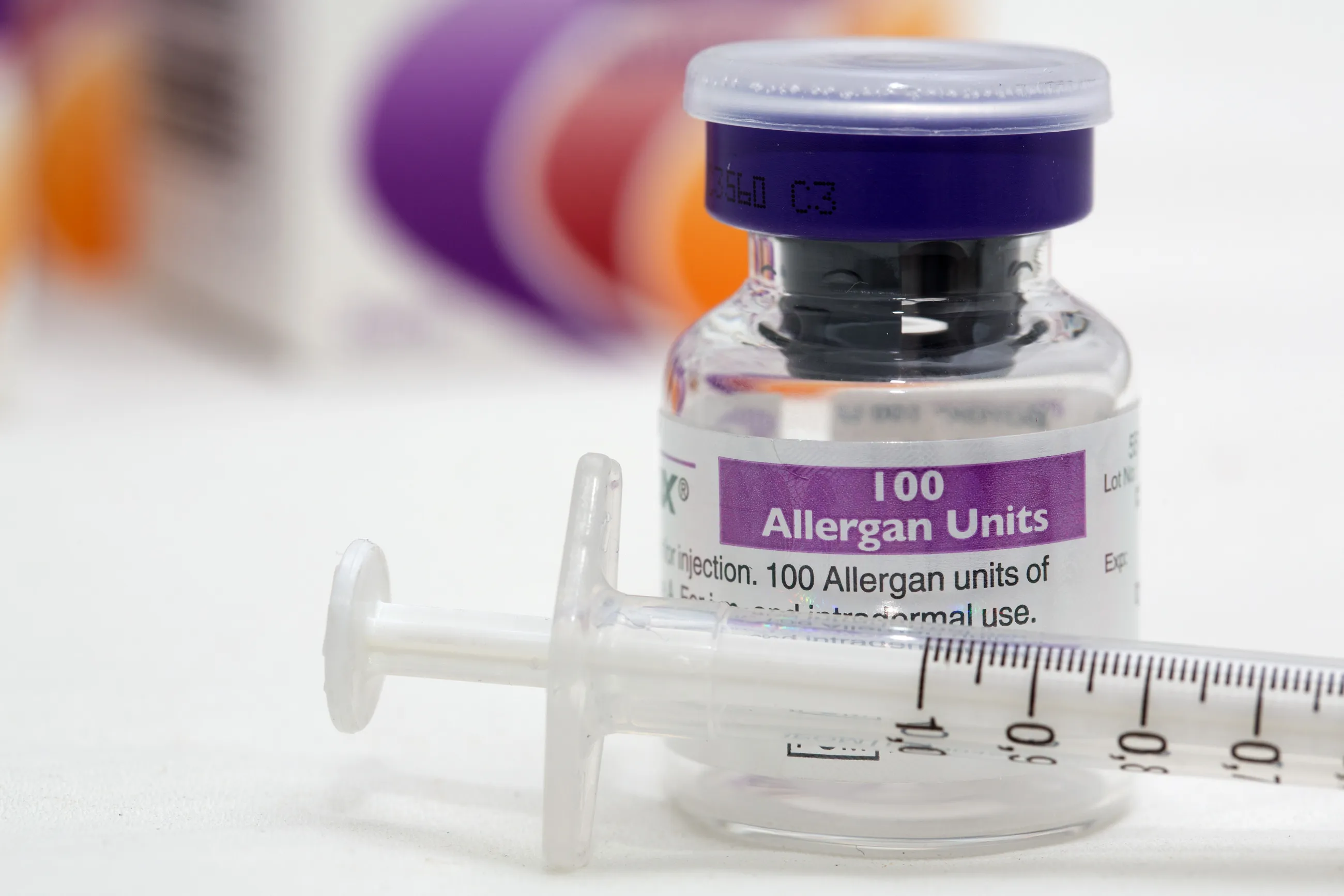 A syringe rests alongside a vial of Allergan Botox, produced by Allergan Inc., in this arranged photograph taken at a skin and beauty clinic in London, U.K., on Monday, Nov. 17, 2014. Actavis Plc agreed to pay about $66 billion for Allergan, a deal that creates a new top 10 drugmaker and ends Valeant Pharmaceuticals International Inc.'s attempt at a hostile takeover of the maker of Botox.