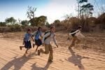 Indian schoolboys and girls walking to school at Doeli in Sawai Madhopur, Rajasthan, Northern India, 2011&#13;
