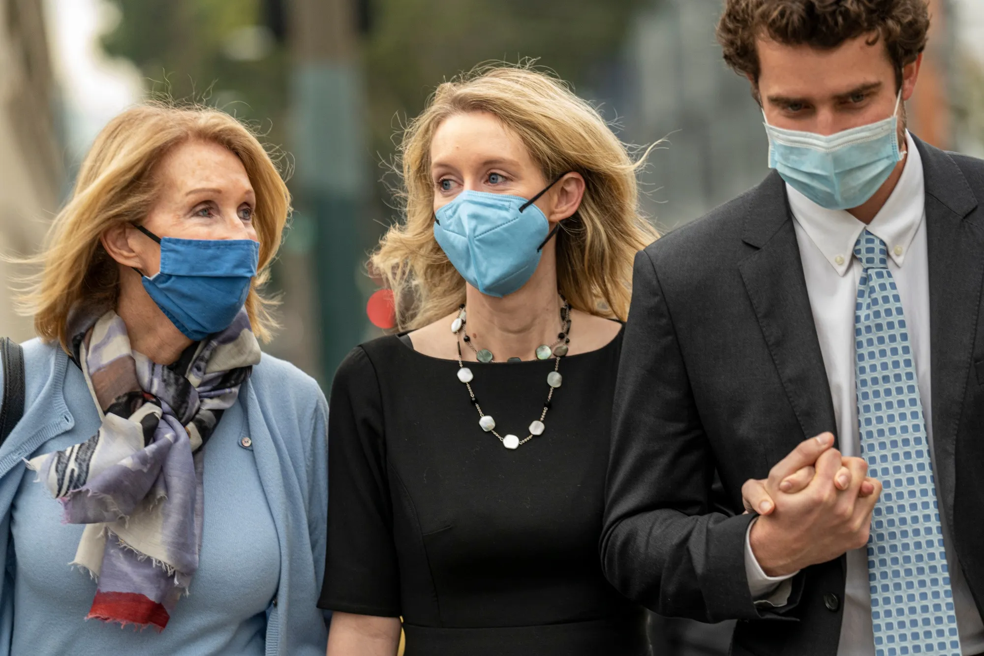 Elizabeth Holmes, center, exits federal court in San Jose, Calif. on&nbsp;Dec. 21.&nbsp;