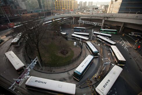 Buses wait in line to enter the Port Authority Bus Terminal in New York.
