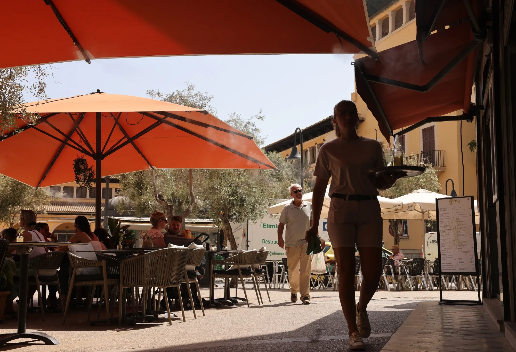 Water misters cool restaurant customers in Palma de Mallorca, Spain on July 18.
