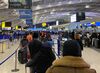 Travelers at London Heathrow Airport, Dec. 20.