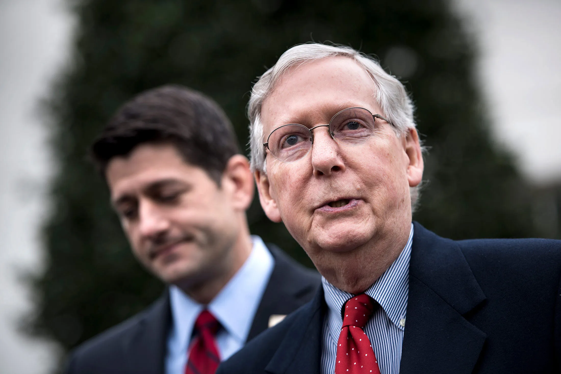 Speaker of the House Paul Ryan listens while Senate Majority Leader Senator Mitch McConnell speaks to the press after meetings with President Donald Trump at the White House on Feb. 27, 2017.