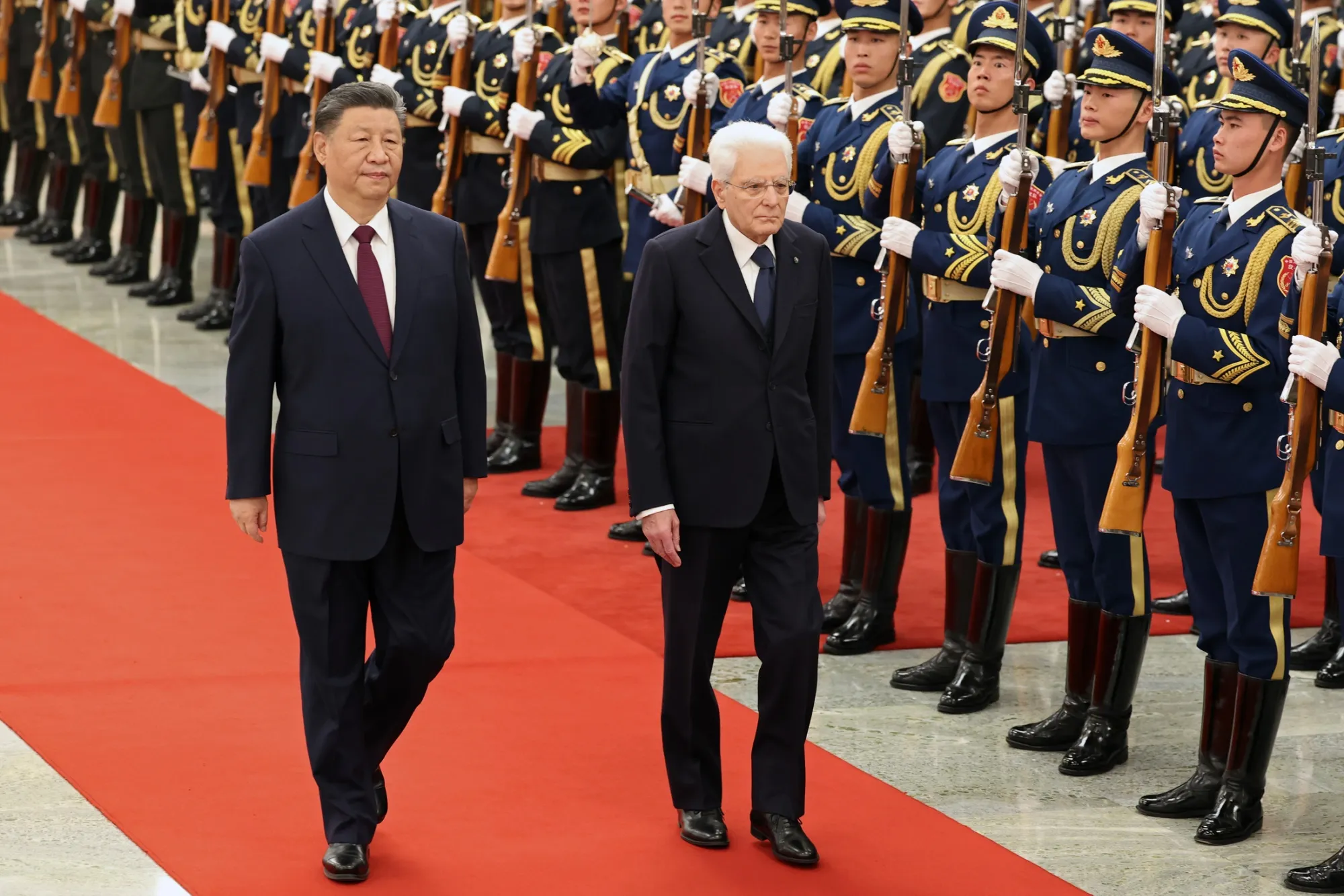 Xi Jinping and Sergio Mattarella review a guard of honor in Beijing on Nov. 8.