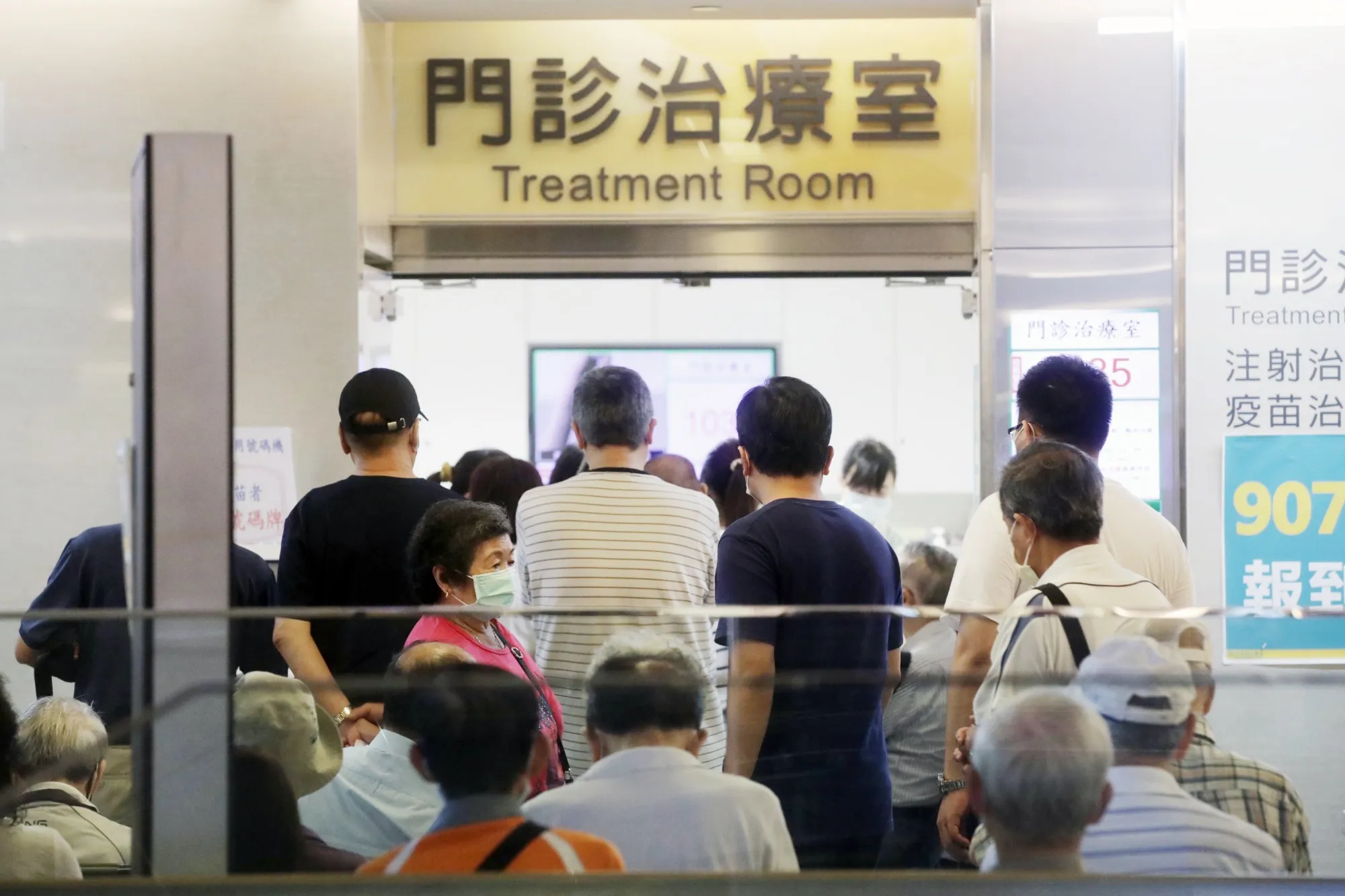 People wait in line at a Covid-19 vaccination center in New Taipei City, Taiwan, on&nbsp;May 13.&nbsp;