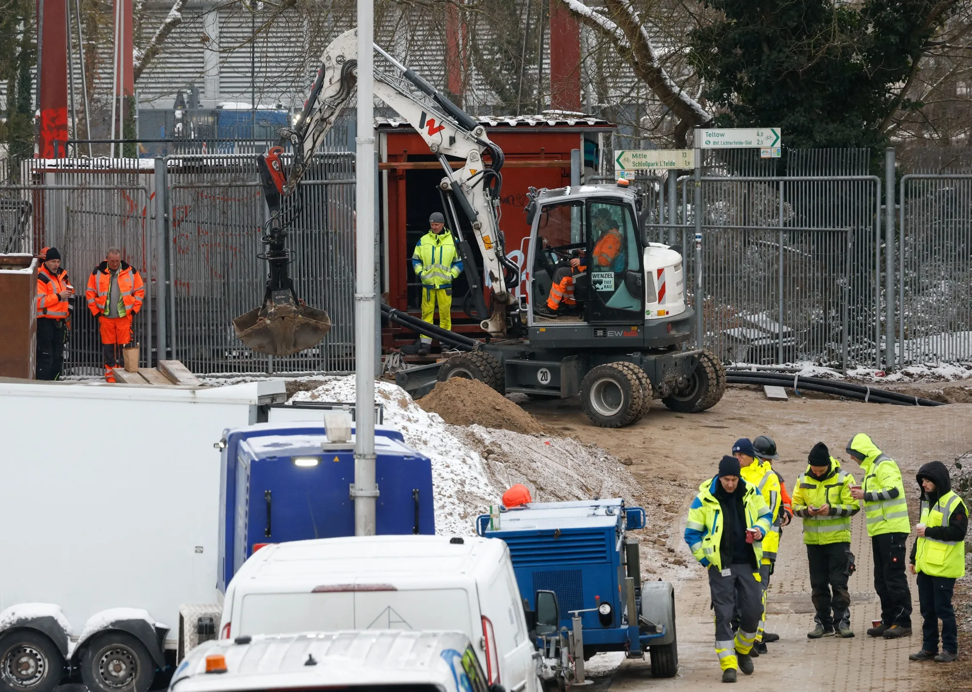 Maintenance workers Jan. 6 on the site where an arson attack a cable bridge in Berlin caused a massive power failure in southwestern districts of the German capital.