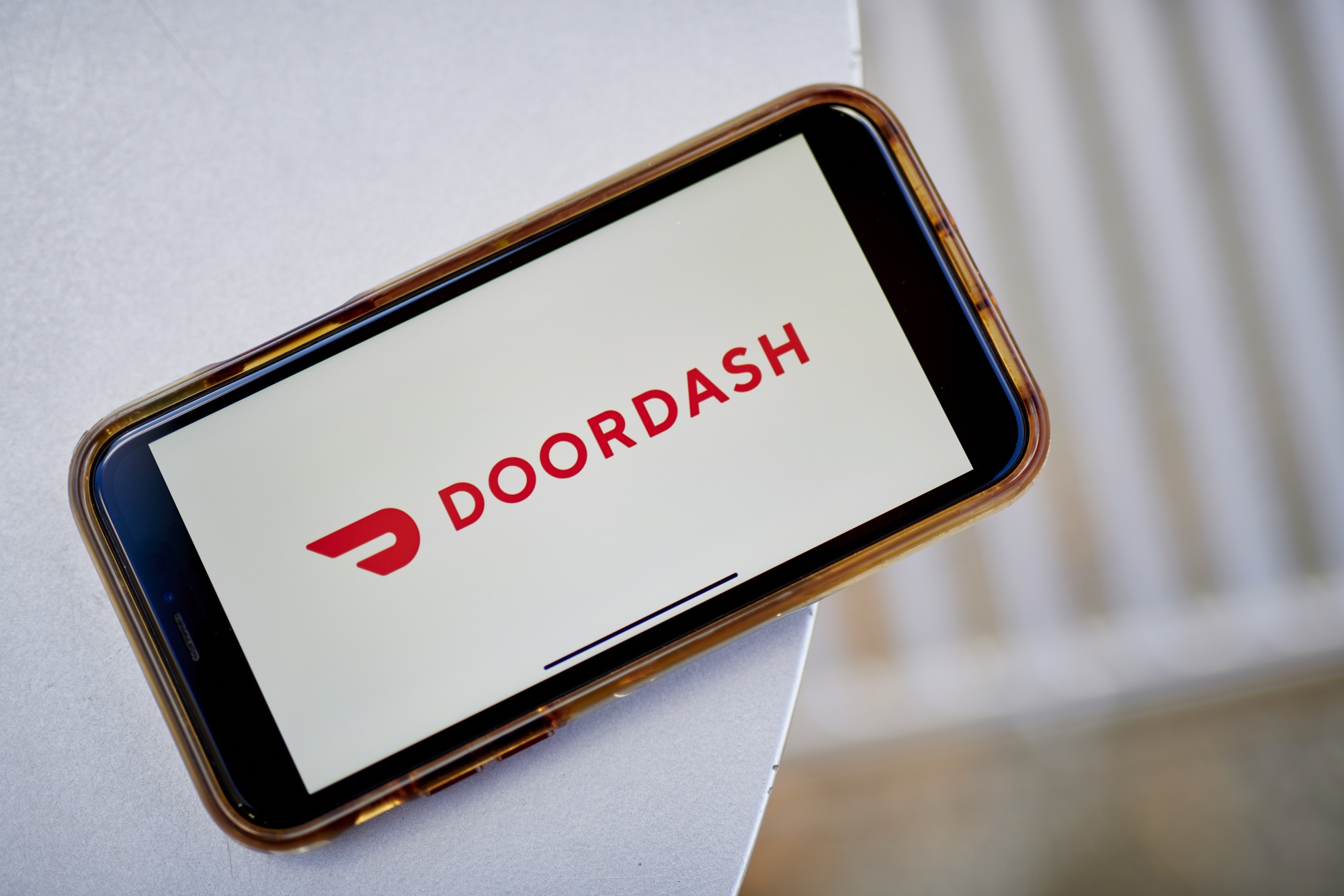 DoorDash projects core profit above estimates as delivery orders