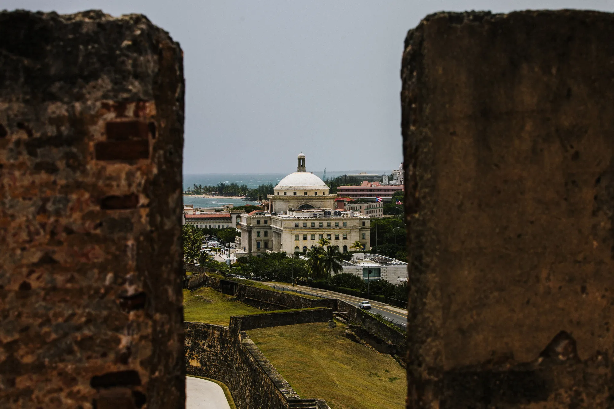 The Capitol Building is seen past walls in the Old City of San Juan, Puerto Rico.