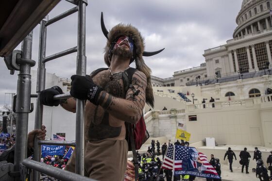 ‘QAnon Shaman’ Pleads Guilty to Obstructing Congress at Riot