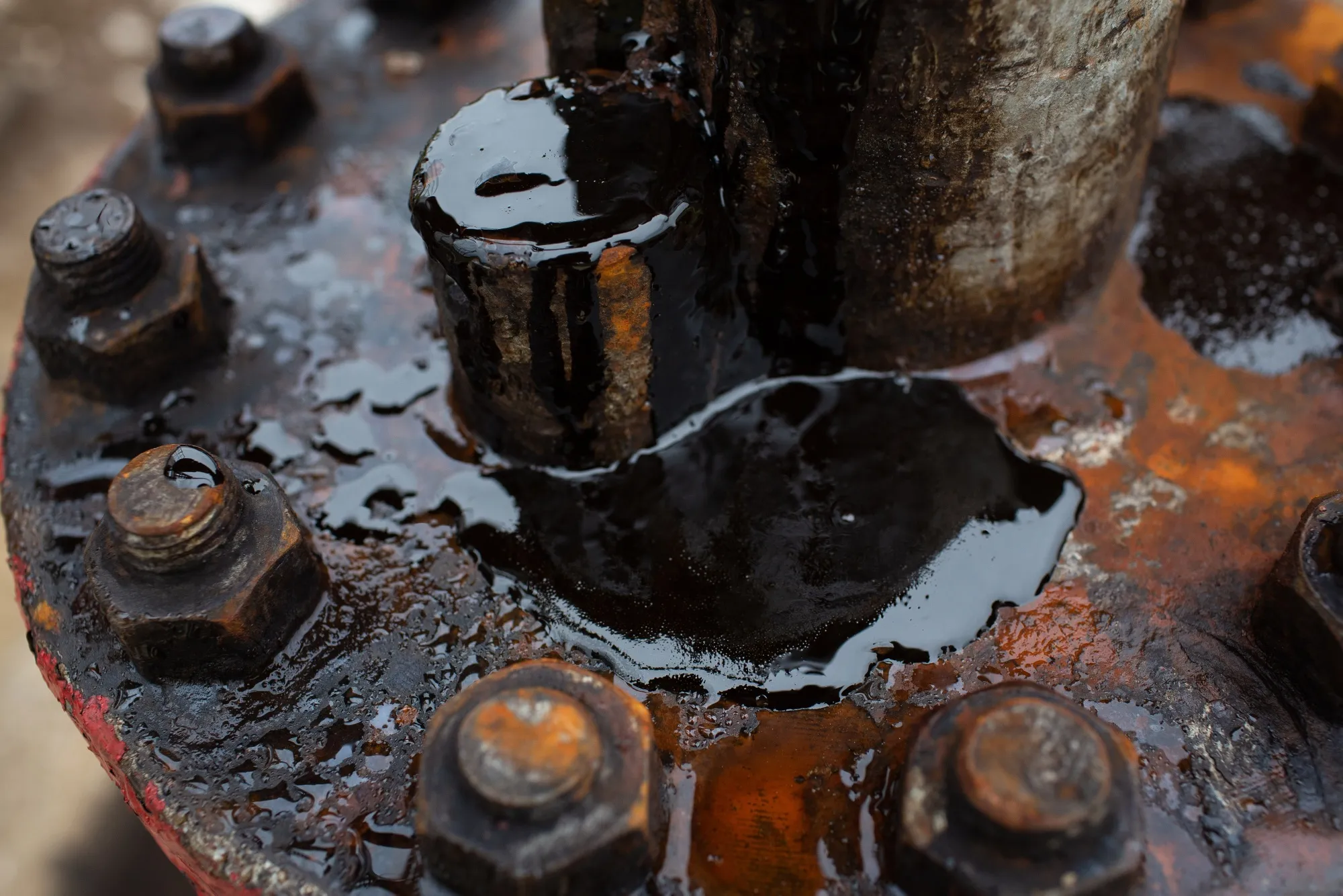 Oil sits on the pipe work fitting of an oil pumping jack&nbsp;in an oilfield near Almetyevsk, Russia.