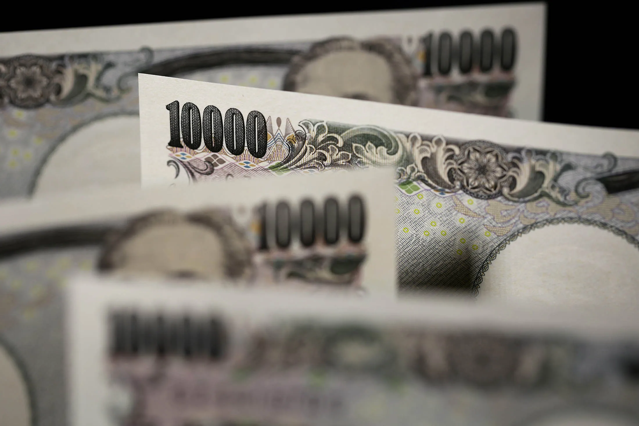 Japanese 10,000 yen banknotes are arranged for a photograph in Tokyo.
