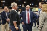 Greg Abel, center, during a shareholders shopping day ahead of the Berkshire Hathaway annual meeting in April.
