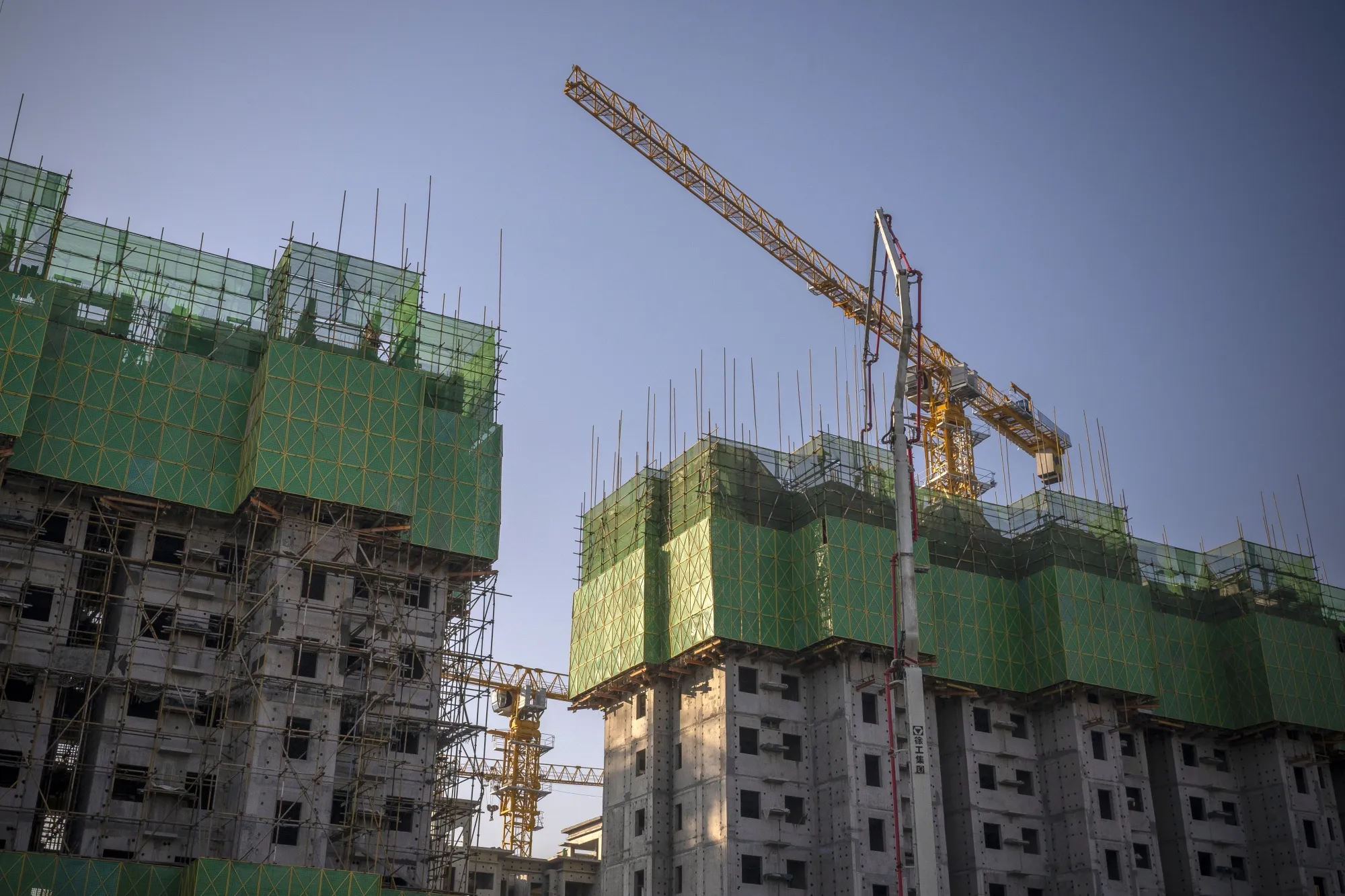 Unfinished apartment buildings at the construction site of a China Evergrande Group development in Beijing, China, on Thursday, Jan. 6, 2022.