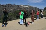 Tourists take selfies with the Hollywood sign in Los Angeles on&nbsp;Feb. 14.