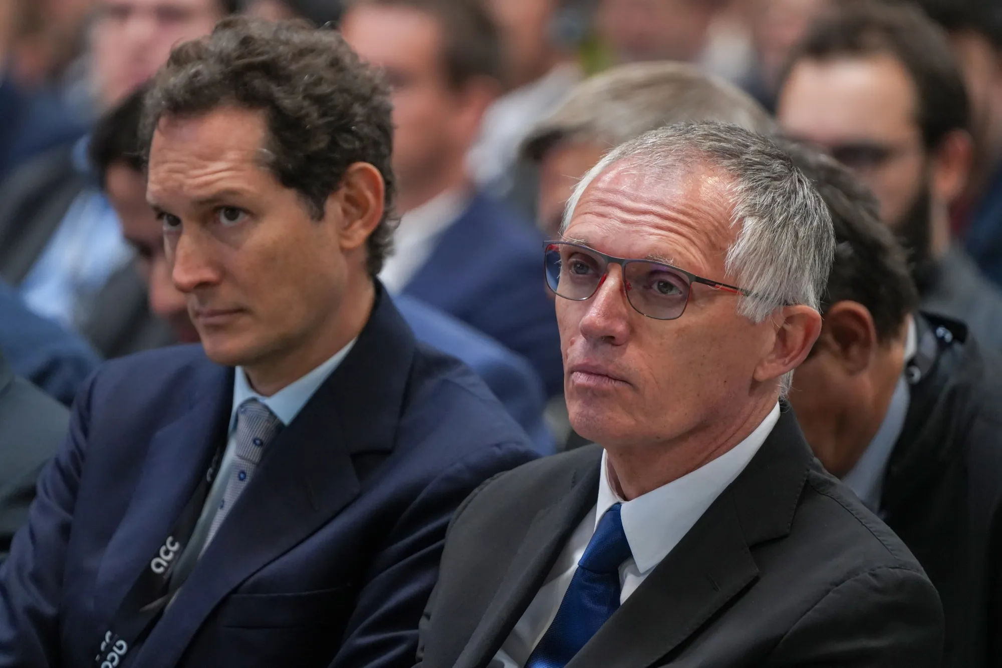 John Elkann, left, and Carlos Tavares