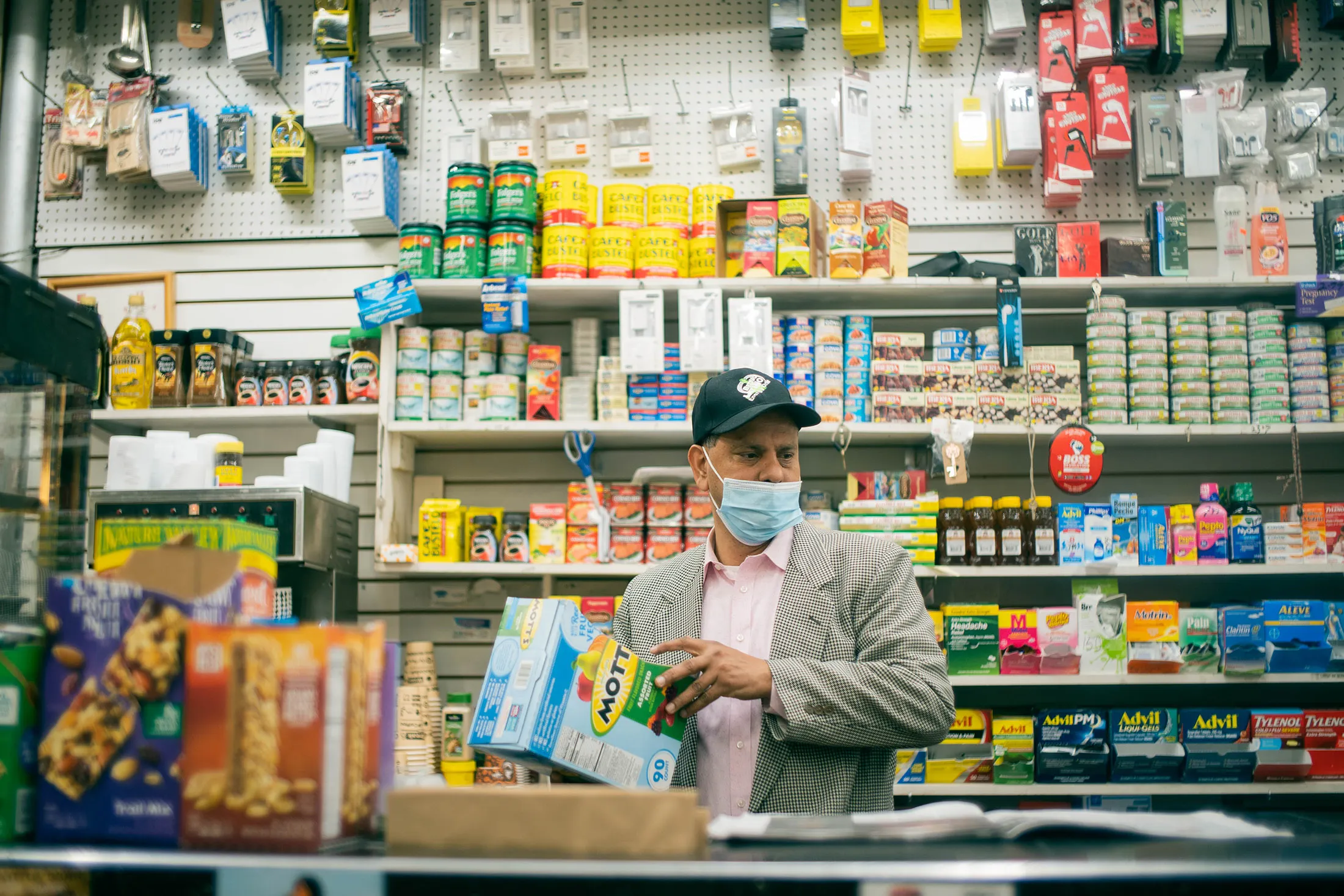 Francisco Marte in his store, the New Green Earth Deli.