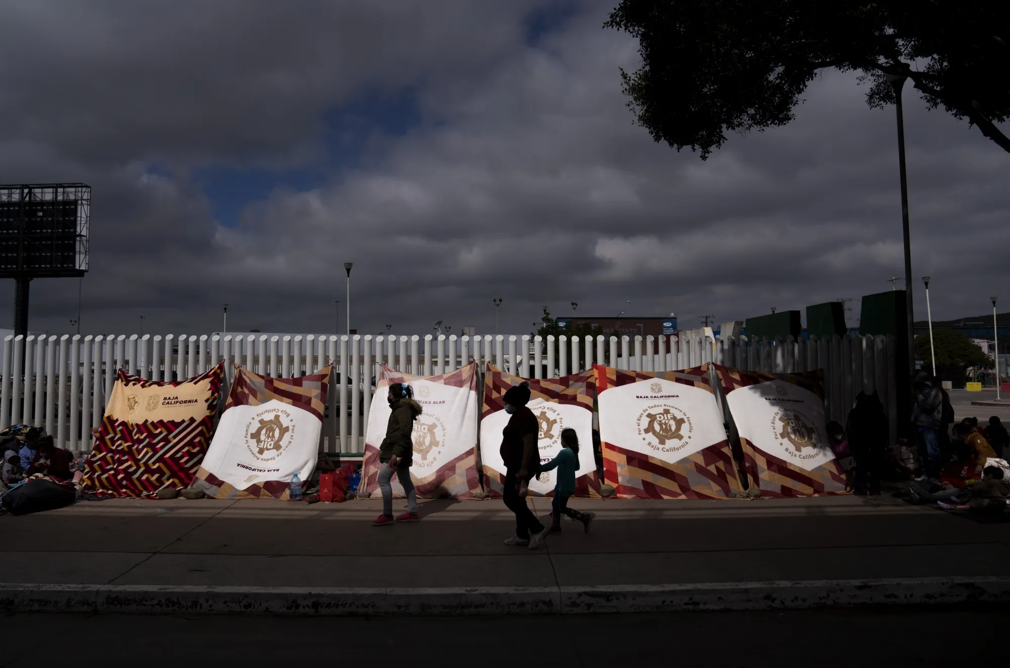 U.S. Lets In Asylum-Seekers Stuck In Mexico, Ends Trump Policy