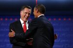 Republican presidential candidate Mitt Romney shakes hands with President Barack Obama during the first presidential debate at the University of Denver