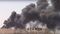 This frame grab from video released on Tuesday, July 4, 2017, and provided by Furat FM, a Syrian Kurdish activist-run media group, shows smoke rising from the Old City of Raqqa following heavy bombing as U.S.-backed Syrian Democratic Forces (SDF) fighters advance toward the center of Raqqa, Syria. The SDF forces have breached the wall around Raqqa's Old City, the U.S. military said Tuesday, marking a major advance in the weeks-old battle to drive Islamic State militants out of their self-declared capital. (Furat FM, via AP)