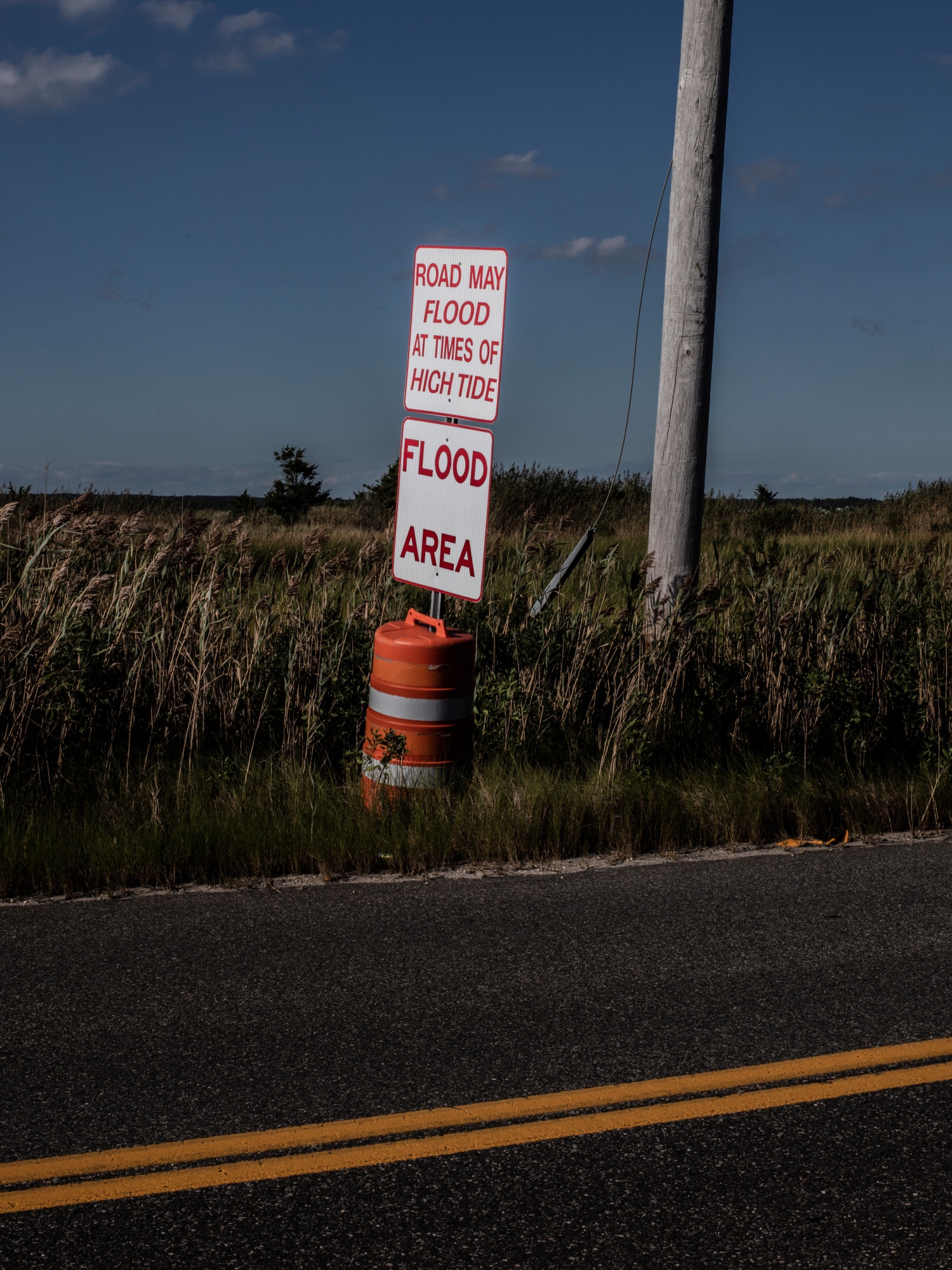 A flood area warning sign seen on Dune Road in the Hamptons.