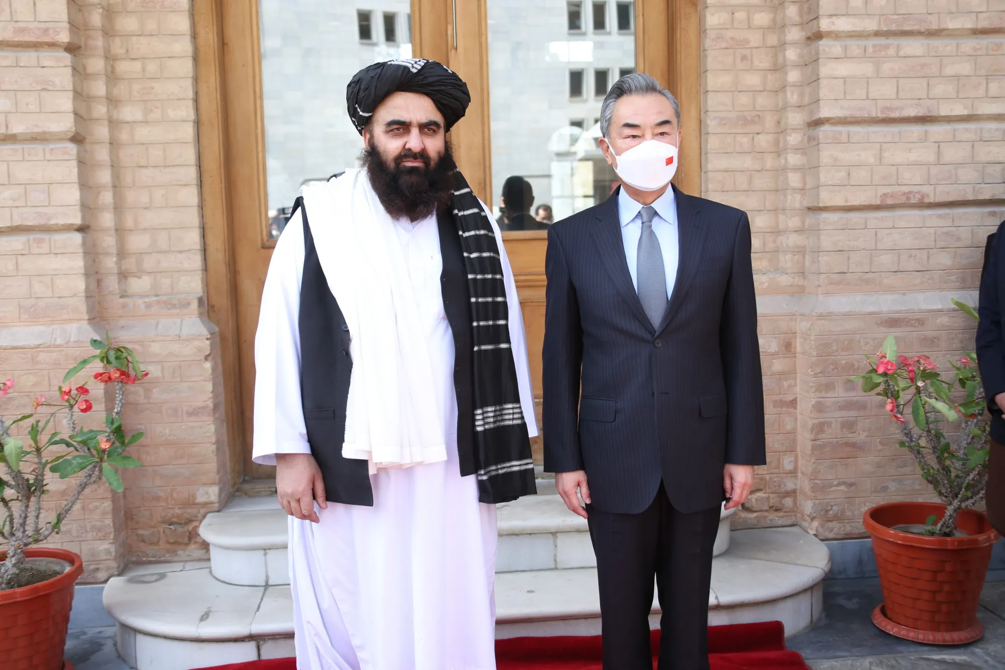 Amir Khan Muttaqi with Wang Yi in Kabul in March.