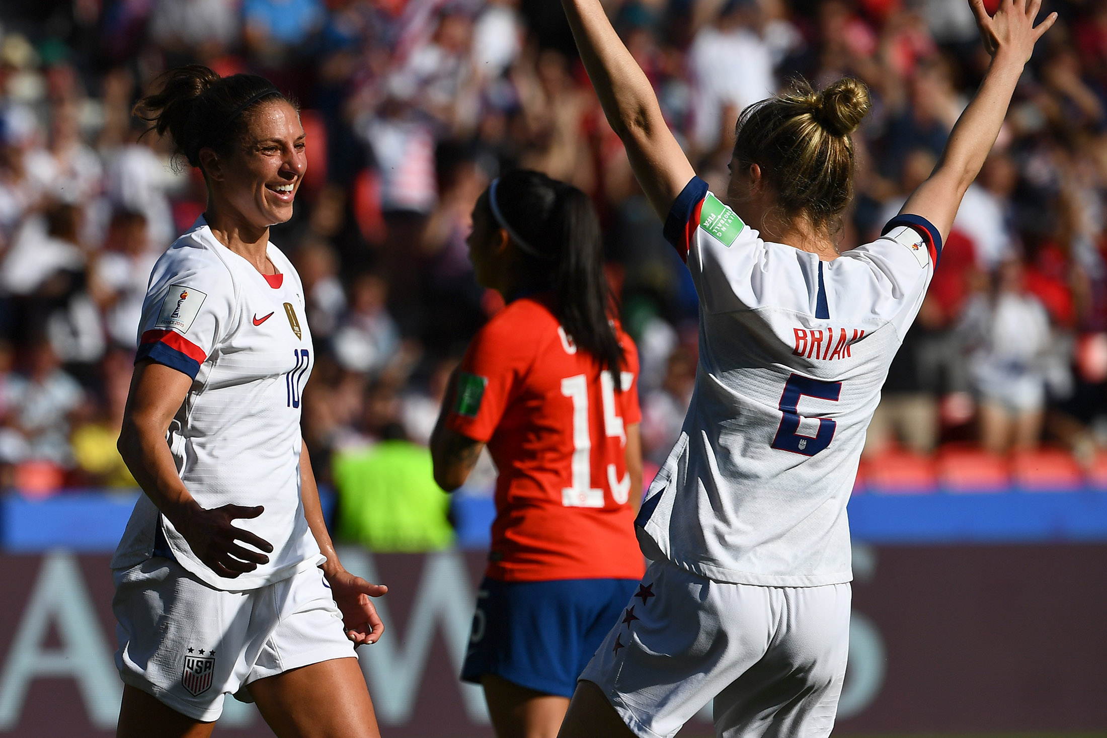 United States' forward Carli Lloyd, left,&nbsp;celebrates after scoring a goal during the France 2019 Women's World Cup match against Chile, on June 16.
