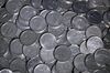 Japanese one yen coins are arranged for a photograph in Tokyo, Japan, on Monday, March 24, 2014. The country's consumption tax is being raised for the first time since 1997 to 8 percent from 5 percent. When the sales tax was introduced at 3 percent in 1989, retailers complained about a shortage of the coins, according to Masao Nakata, an economics professor at Seijo University in Tokyo.