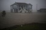 Storm surge surrounds a home as Hurricane Delta makes landfall in Port Arthur, Texas, in 2020.