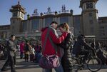 A couple says goodbye before leaving to visit respective families for the Spring Festival in Beijing. More than 2.9 billion passenger trips, including 332 million on the country’s rail networks, are expected by China’s Ministry of Transportation to be made over the New Year period.
