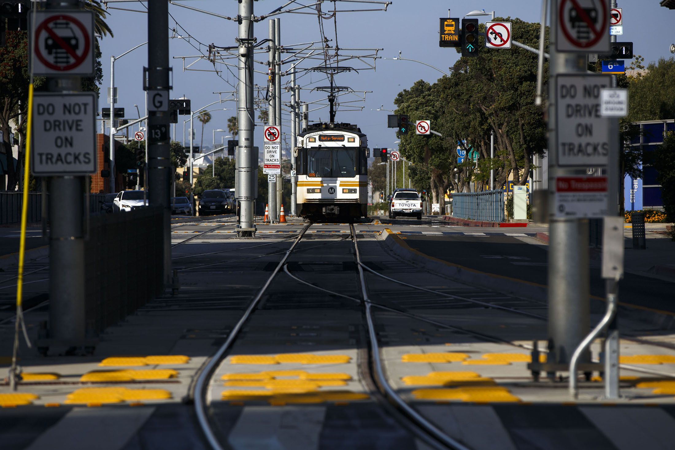A Metro Expo Line test train approaches the Downtown Santa Monica Metro Expo Line light rail station.
