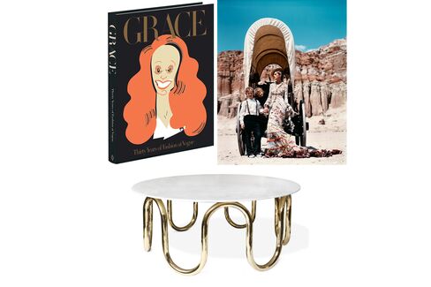 Pictured: Arthur Elgort’s 2001 photograph of Stella Tennant, Matthew Avedon, and Ansel and Warren Elgort, styled by Grace Coddington (top); Jonathan Adler’s Carrera marble-topped brass coffee table (bottom).