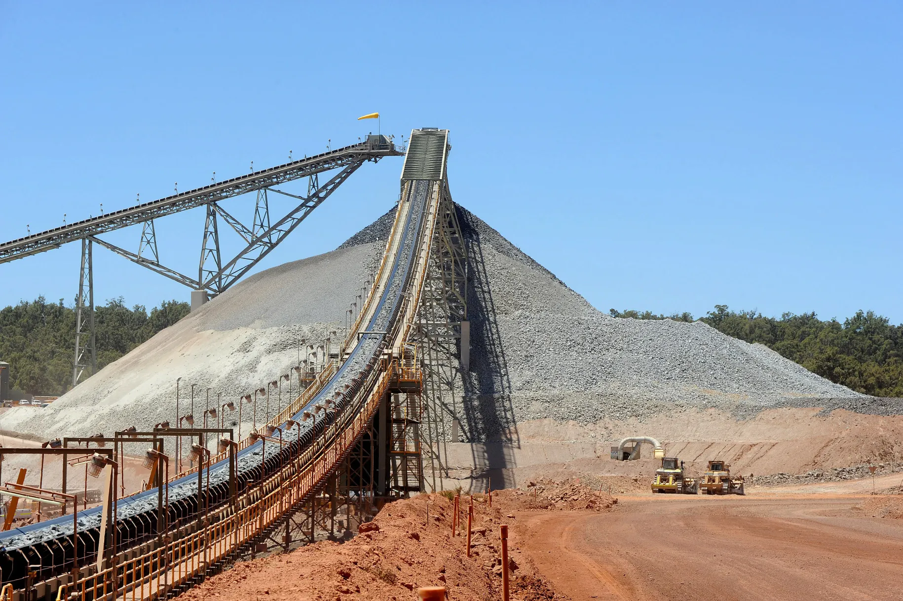 A conveyor belt transports rocks during the gold separation process at a gold mine.