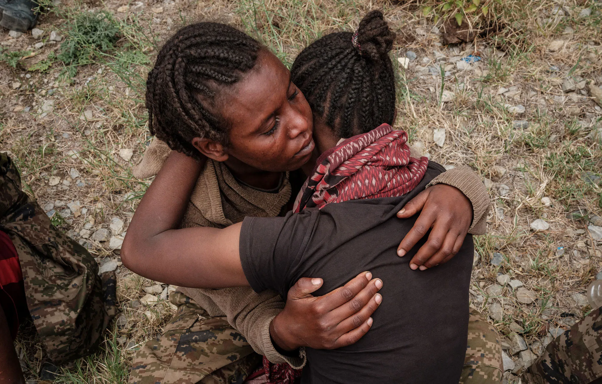 Captive Ethiopian soldiers console each other upon their arrival to the Mekele Rehabilitation Center in Mekele, the capital of Tigray region, on July 2.