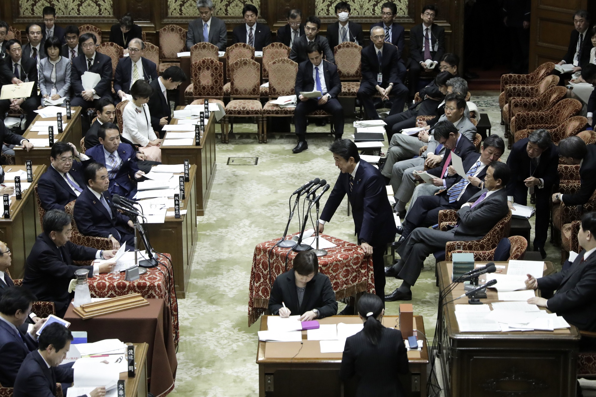 Shinzo Abe speaks at the lower house of parliament in Tokyo on Feb. 26.