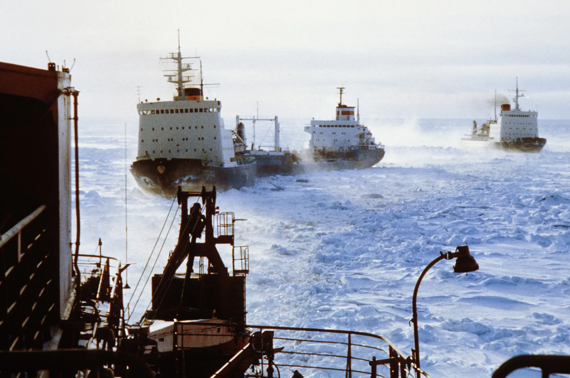 A convoy of&nbsp;Russian icebreakers clears&nbsp;a shipping lane through arctic ice.