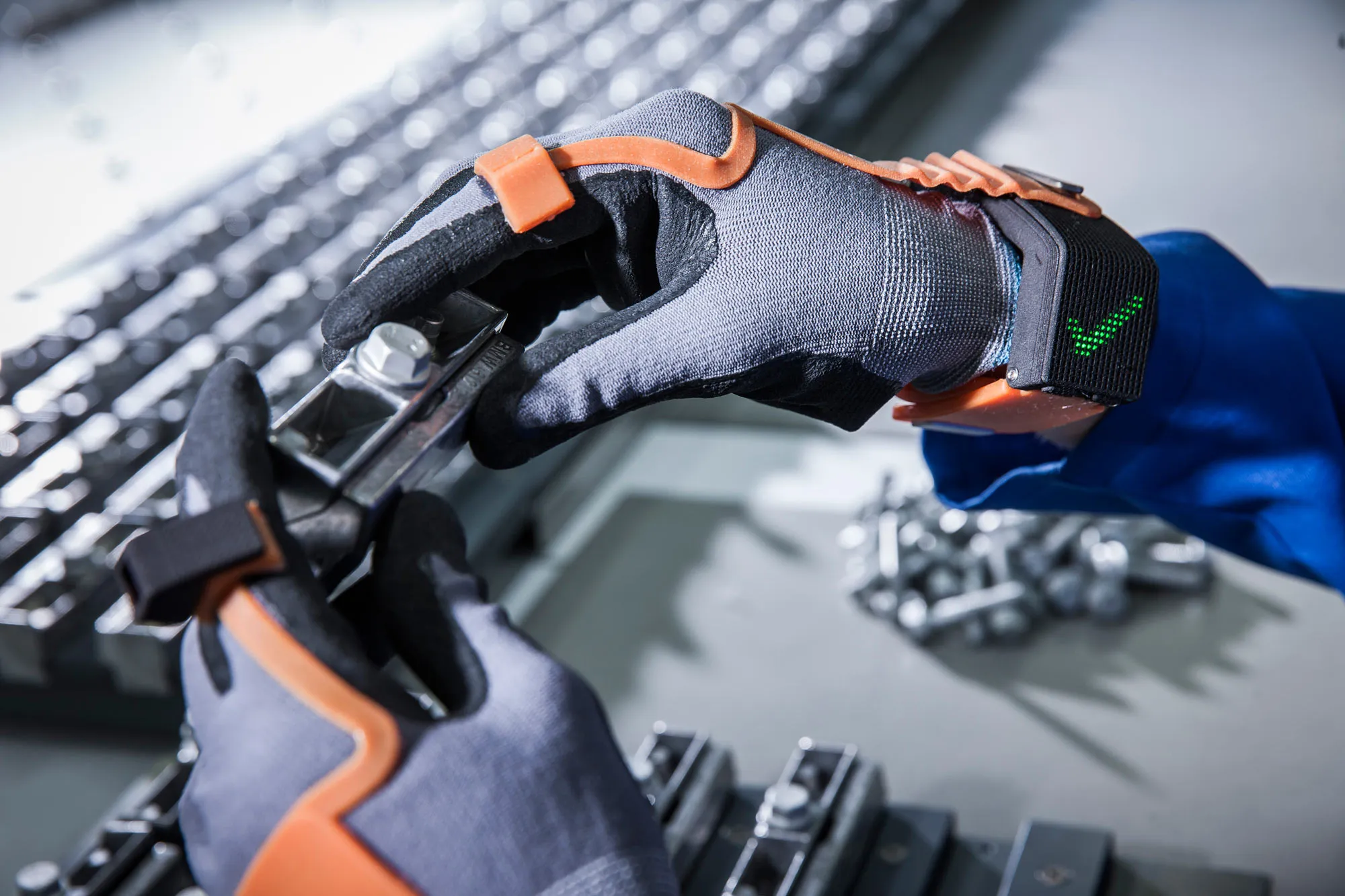 ProGlove, developed by Workaround, is an “intelligent” glove that uses chips to power a simple display on the wrist. If the person wearing the glove completes an assembly task correctly, a large green check mark appears.
