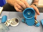 Charlie Goedeke demonstrates how the motor of the fabric shaver works.