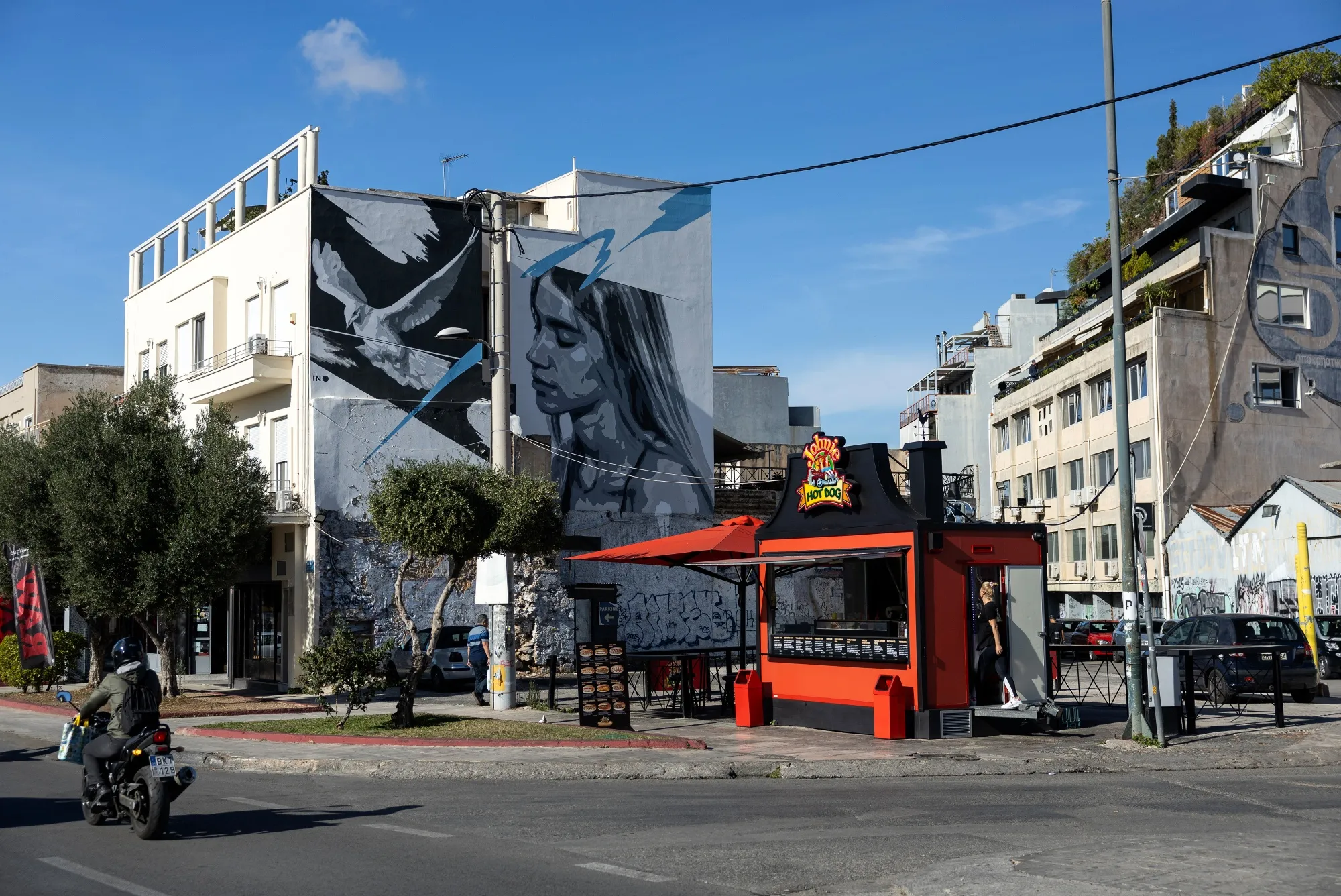A hot dog stand by apartment blocks in the Gazi district of Athens, Greece.