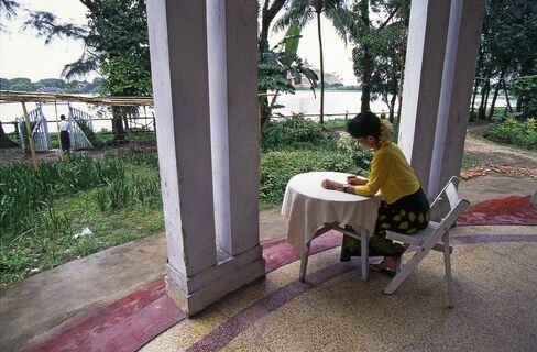 Aung San Suu Kyi under house arrest at her lakeside Yangon mansion in 1996.