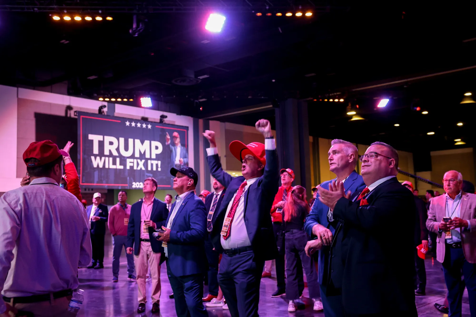 Attendees react as election results are broadcast during the election night event with Donald Trump at the Palm Beach Convention Center in West Palm Beach, Florida, on Nov. 5.