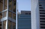 The Trump International Hotel & Tower displays the letters "TR" after workers began taking down the "Trump" sign in Toronto, Ontario.