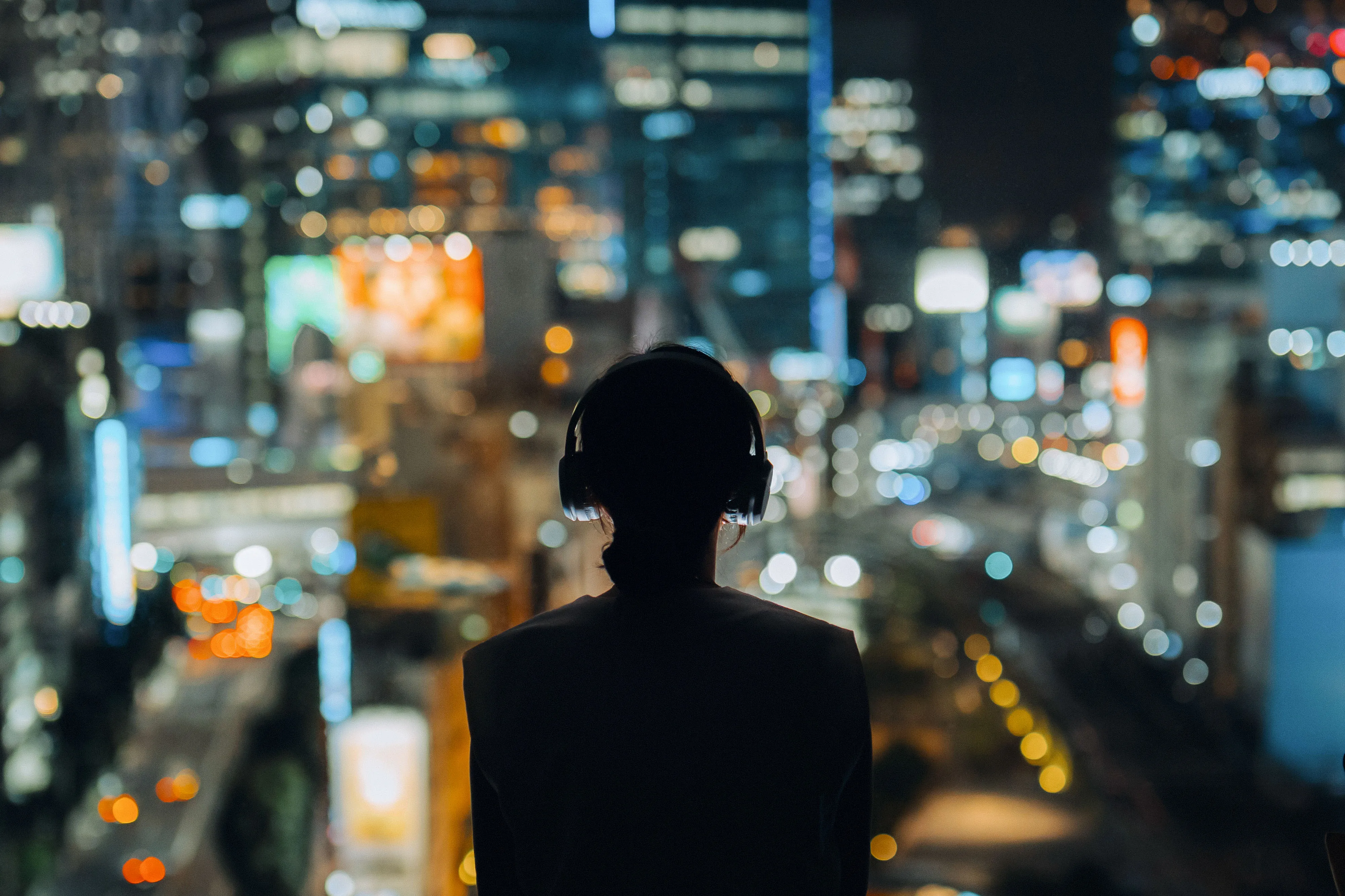A resident wearing&nbsp;headphones in Tokyo.