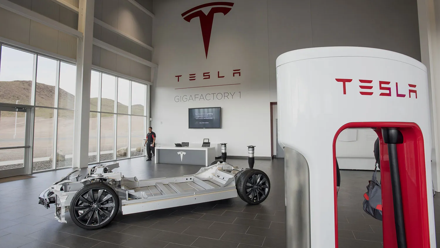 A vehicle charger stands in the lobby at the Tesla Motors Inc. Gigafactory in McCarran, Nevada, on April 25, 2016.
