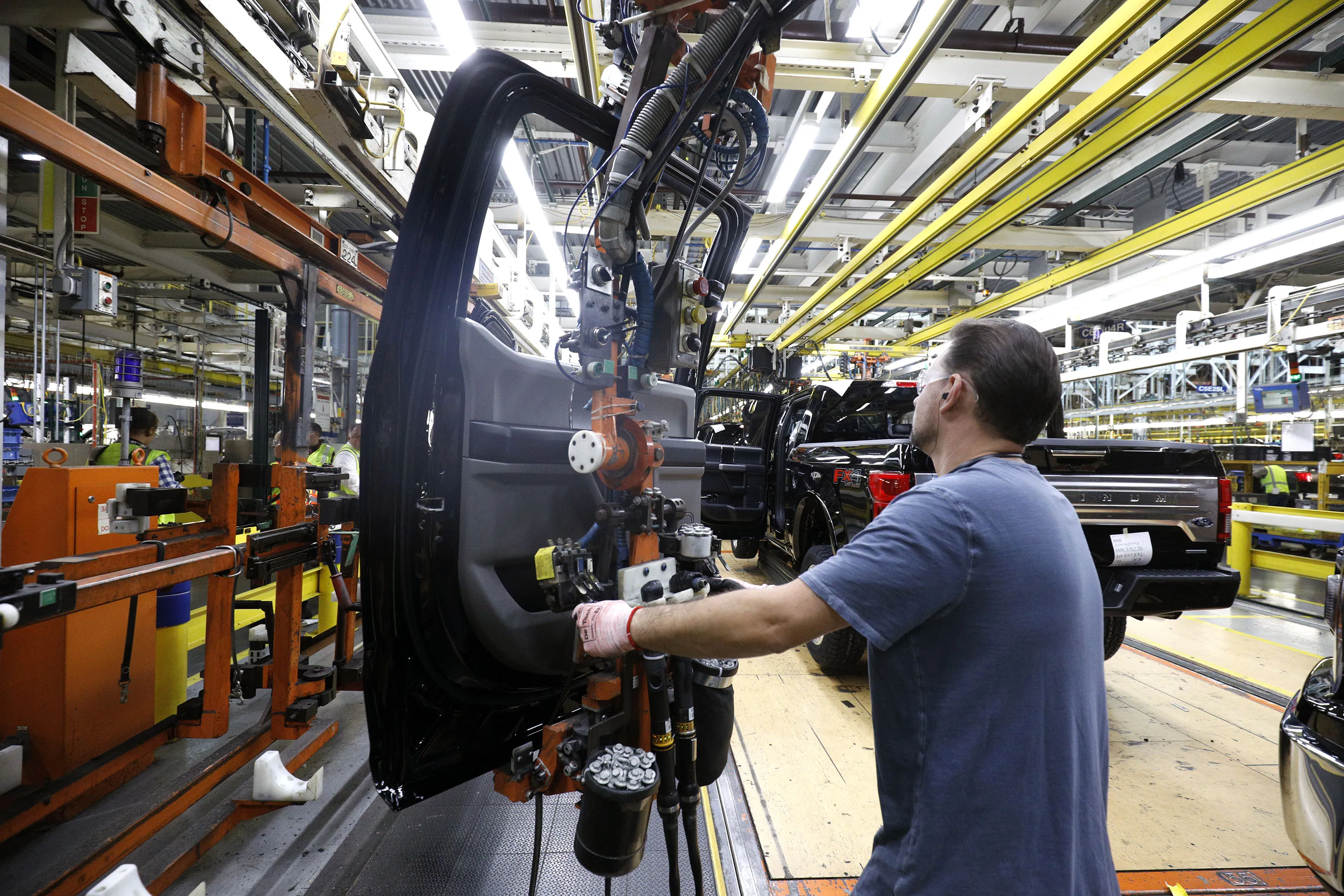 Workers&nbsp;on&nbsp;the assembly line at the Ford Dearborn Truck Plant in Michigan. Carmakers had the highest proportion of ratings action citing environmental considerations, followed by coal mining, coal terminals as well as regulated electric and gas utilities with generation.