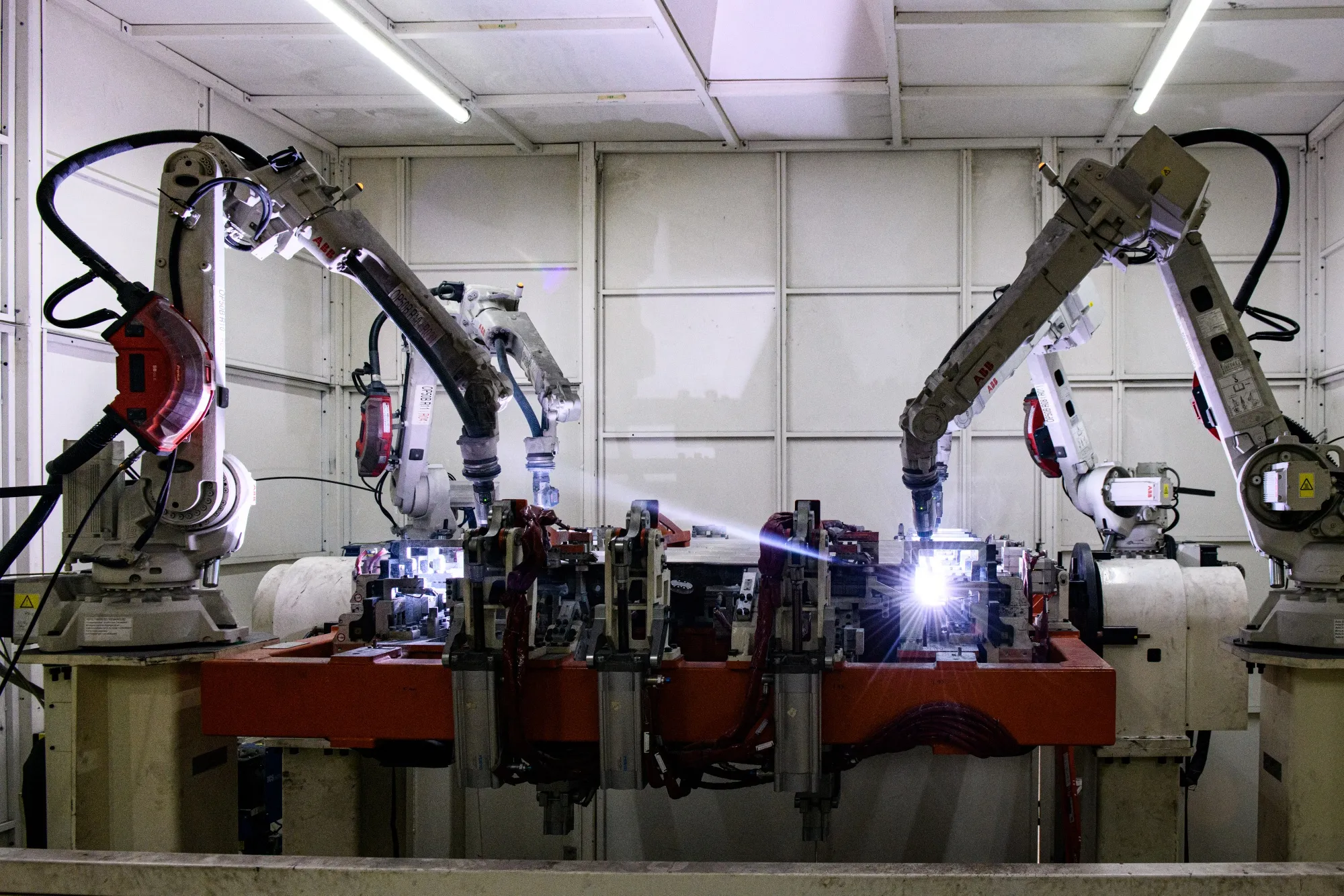 Robotic arms operate at a Linamar Corp. of Canada EV battery case manufacturing facility.