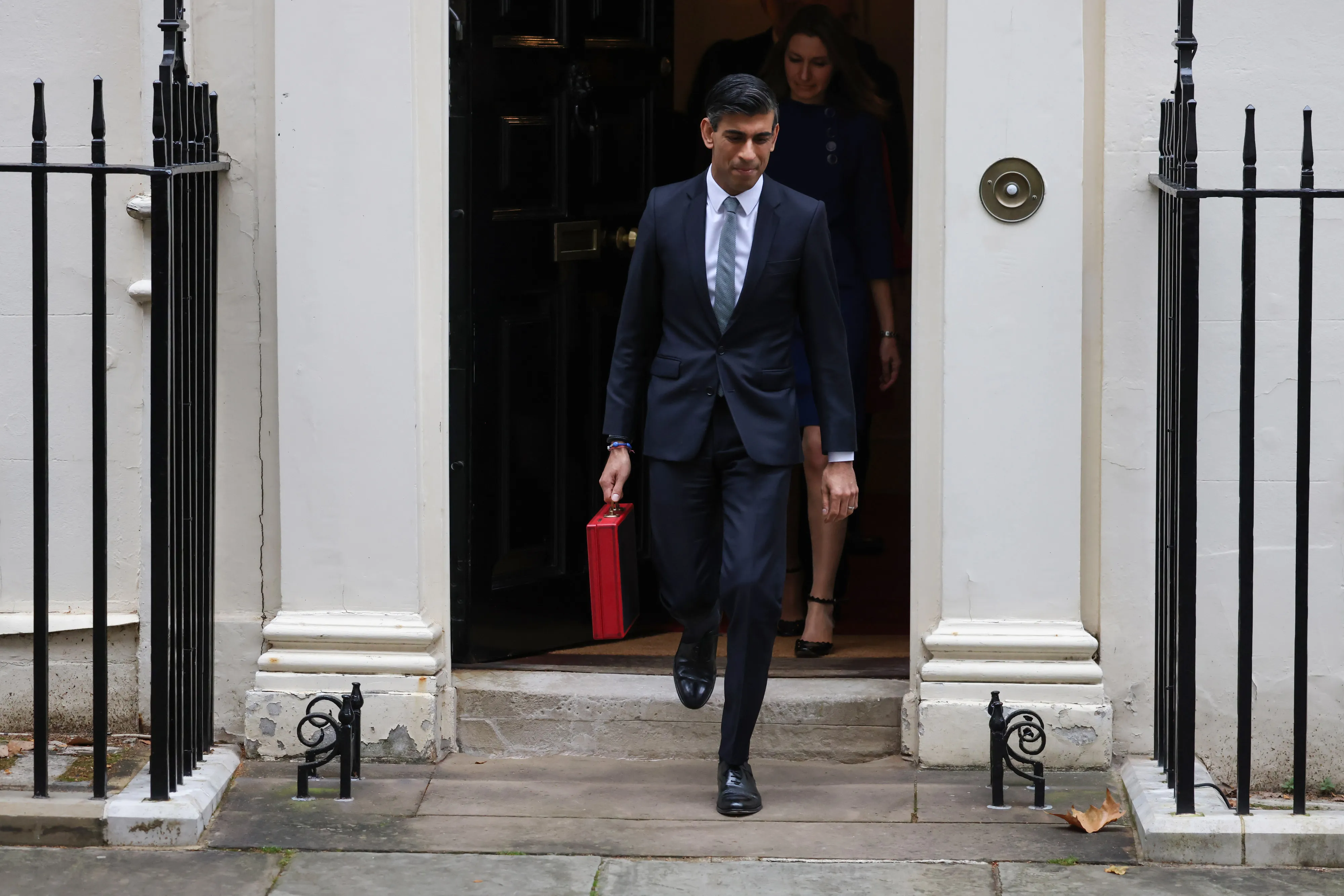 Rishi Sunak departs from number 11 Downing Street with his ministerial dispatch box on his way to present his spending review in Parliament in London, on Oct. 27.