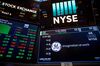 A monitor displays General Electric Co. signage on the floor of the New York Stock Exchange (NYSE) in New York, U.S., on Monday, May 21, 2018.