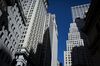 Buildings stand on Wall Street near the New York Stock Exchange (NYSE) in New York, U.S., on Monday, Feb. 22, 2016. Stocks retreated with government bonds, while the euro rallied to the highest level in almost a month as investors looked past an unprecedented boost from European monetary policy to focus on rising anxiety that policymakers have lost the ability to jumpstart global growth and stave off deflation.